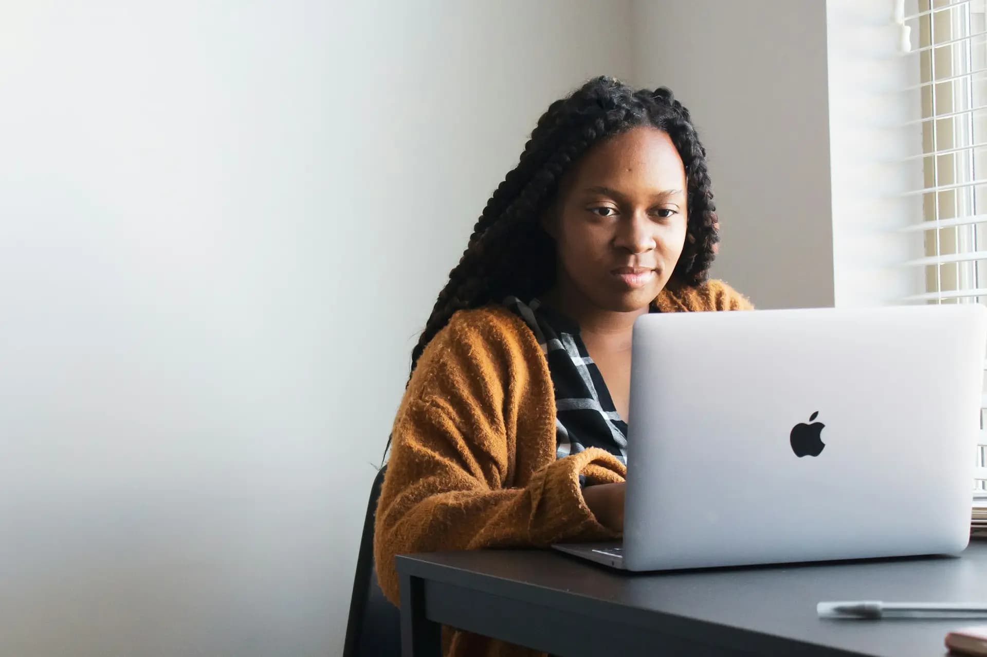 Learner working on a laptop at a desk