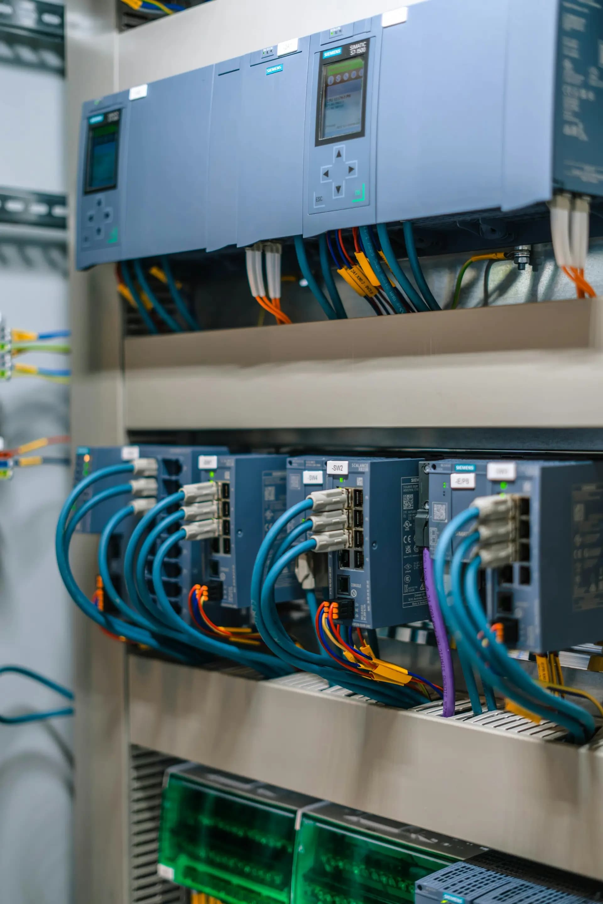 Industrial control panel with network cables and drive modules