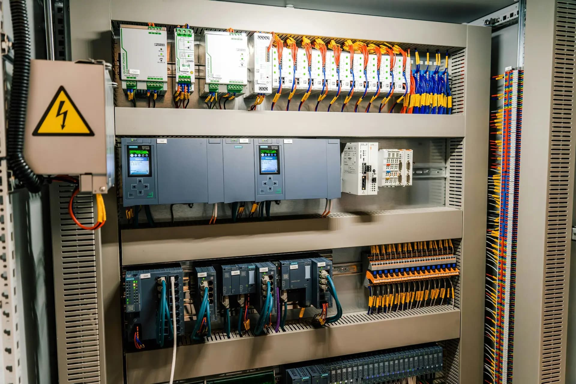 Control cabinet with PLC, power supplies and terminal blocks