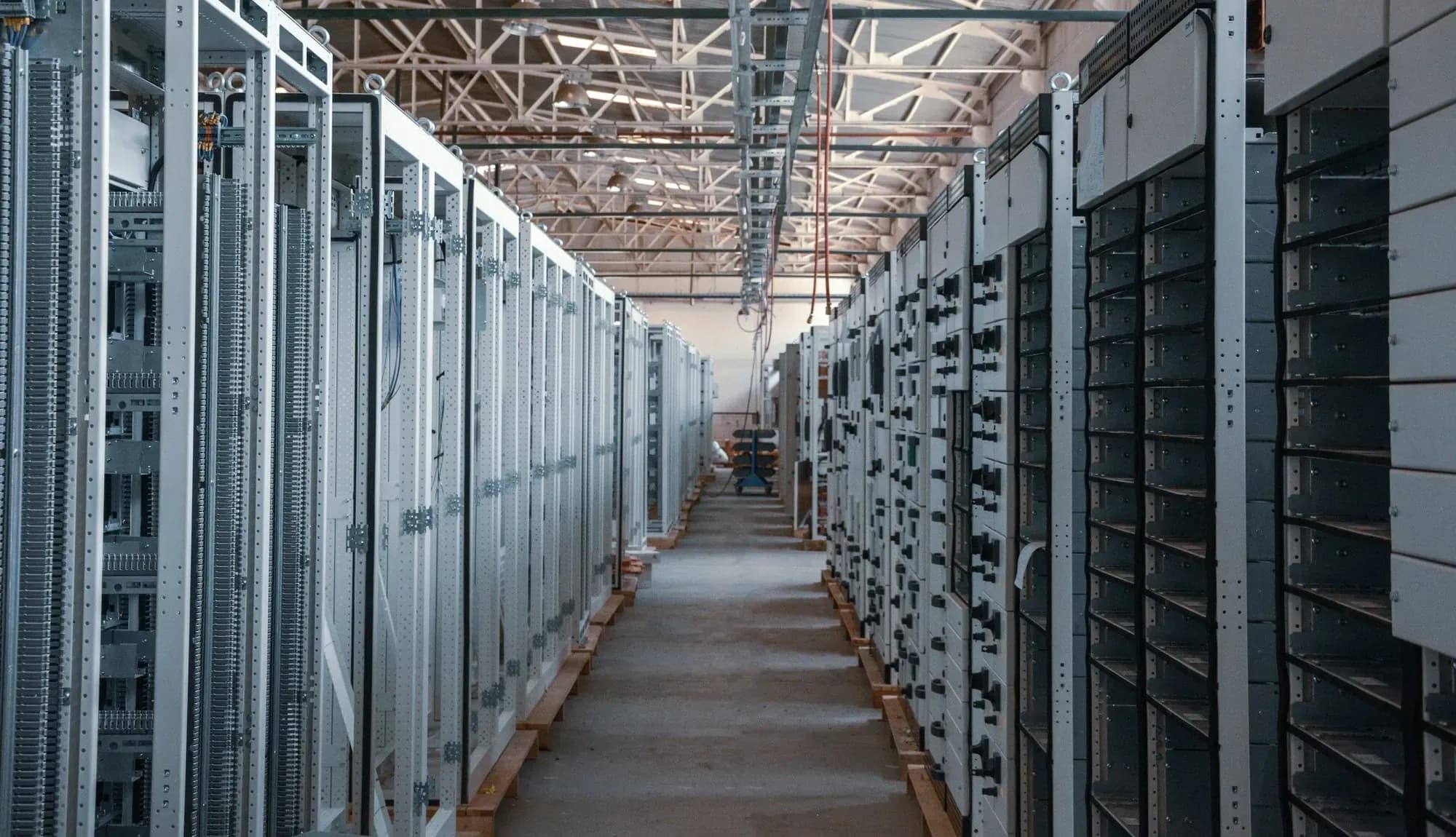 Long aisle of server and network cabinets in a data hall