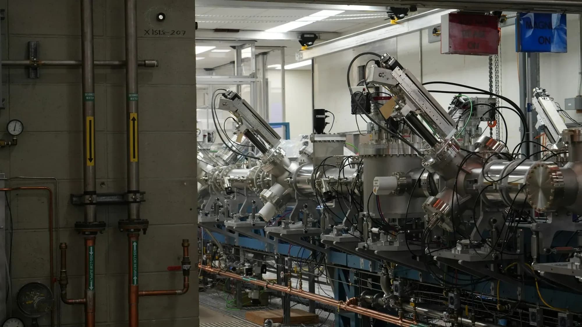 Row of complex automated machinery in a modern production facility