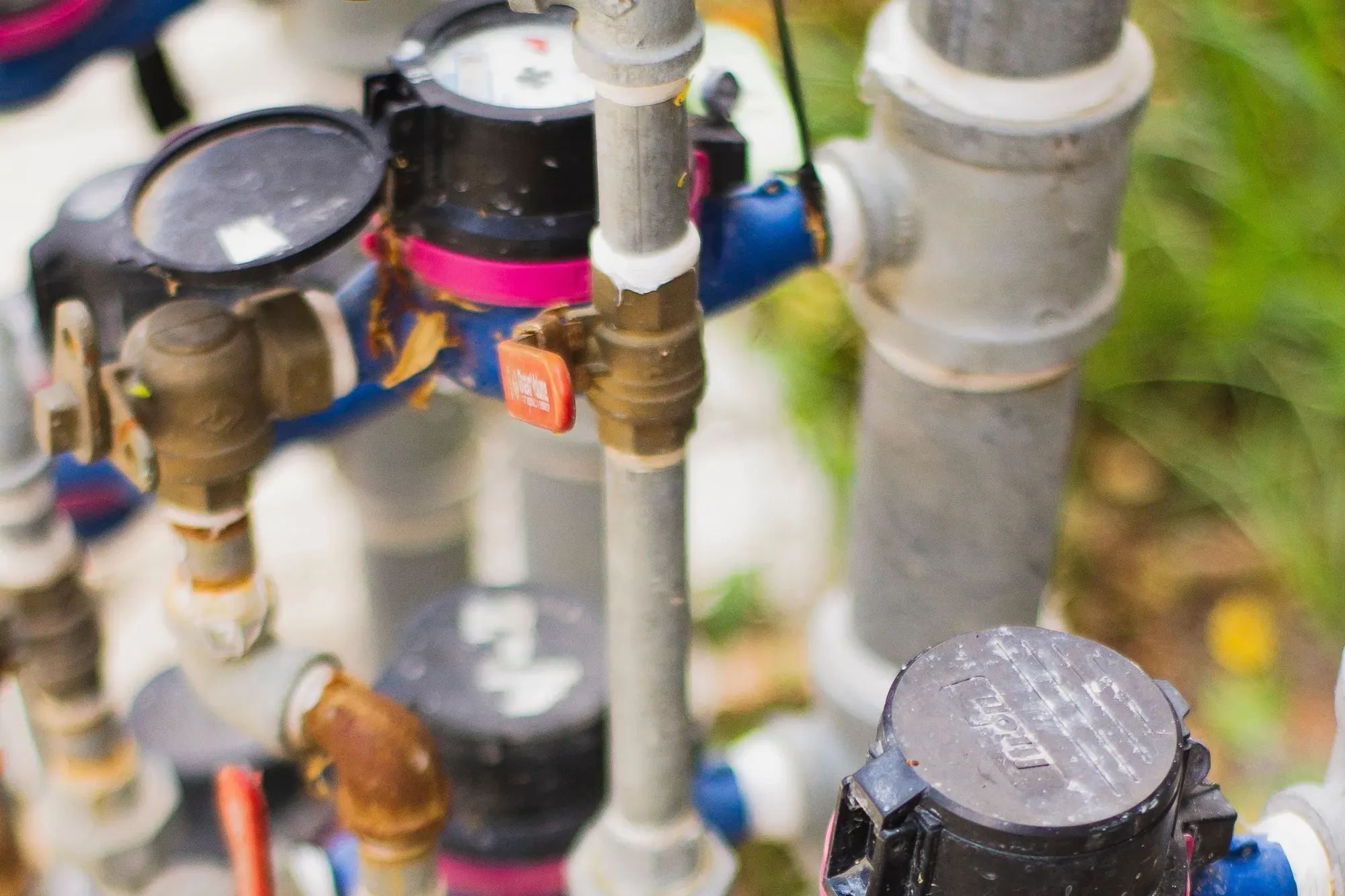 Brass valves, meters and pipework in a utility plant: the kind of field equipment an instrument technician checks and calibrates